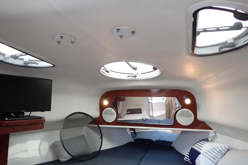 Slide: The Image of Interior of 2002 Pro-Line 33 WA boat with cozy cabin and modern amenities. - 91