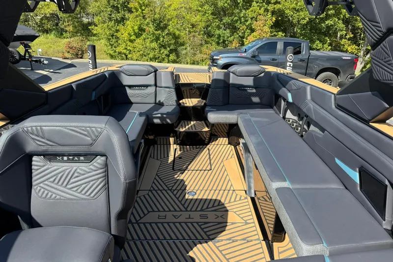 Slide: The Image of 2025 MasterCraft XStar 25 interior with luxurious seating and modern design. - 11