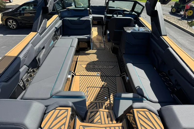 Slide: The Image of 2025 MasterCraft XStar 25 interior with luxurious seating and modern design. - 12