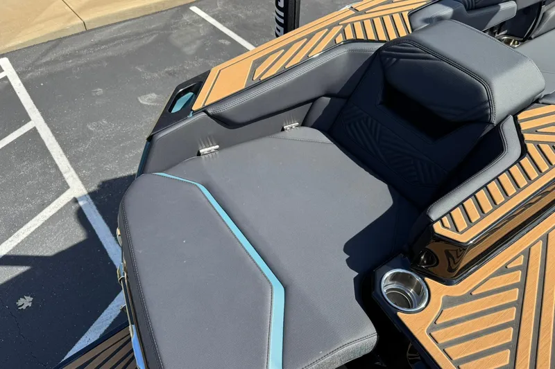 Slide: The Image of 2025 MasterCraft XStar 25 boat interior with sleek seating and modern design. - 13