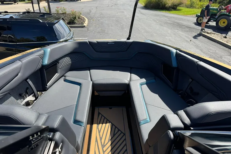 Slide: The Image of 2025 MasterCraft XStar 25 boat interior with luxurious seating and modern design. - 8