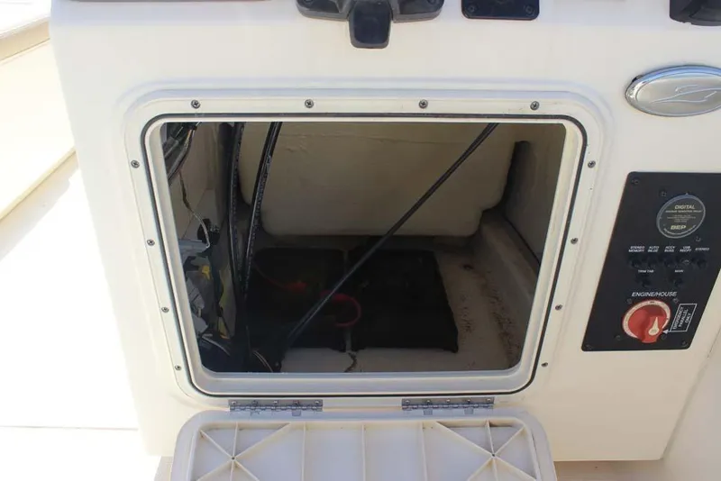 Slide: The Image of 2021 Scout 195 Sport Dorado boat interior with storage and cup holders. - 10