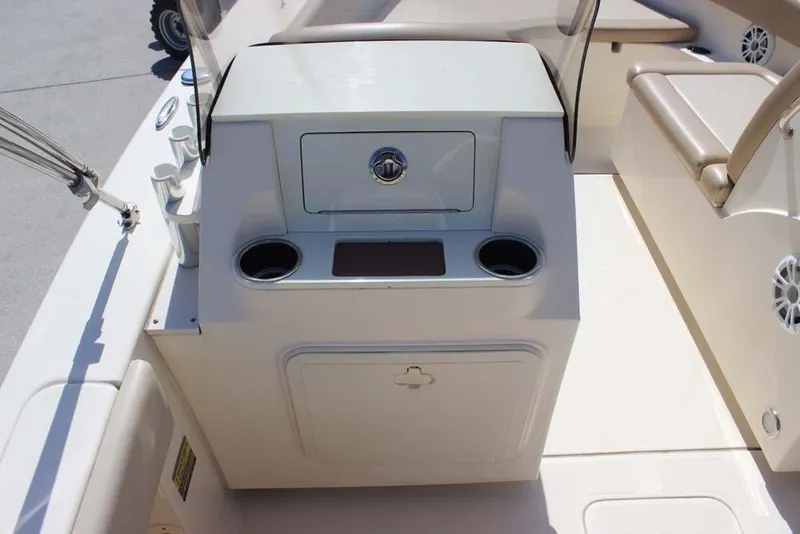 Slide: The Image of 2021 Scout 195 Sport Dorado boat interior with storage and cup holders. - 11