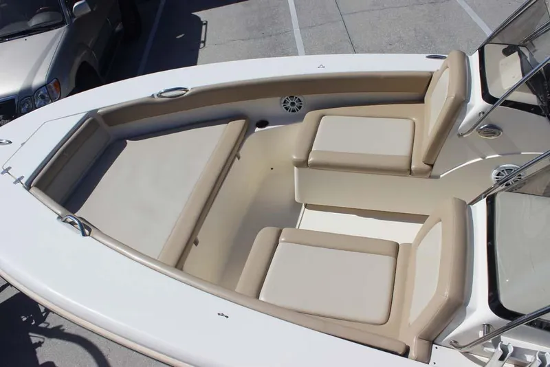 Slide: The Image of 2021 Scout 195 Sport Dorado boat interior with beige seating and deck. - 15