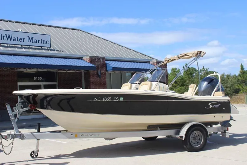 Slide: The Image of 2021 Scout 195 Sport Dorado boat on trailer outside SaltWater Marine. - 2