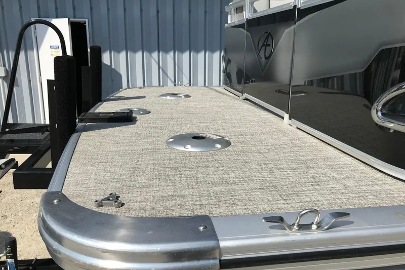 Slide: The Image of 2024 Avalon VENTURE FISH-N-CRUISE boat deck with metallic accents and textured flooring. - 11
