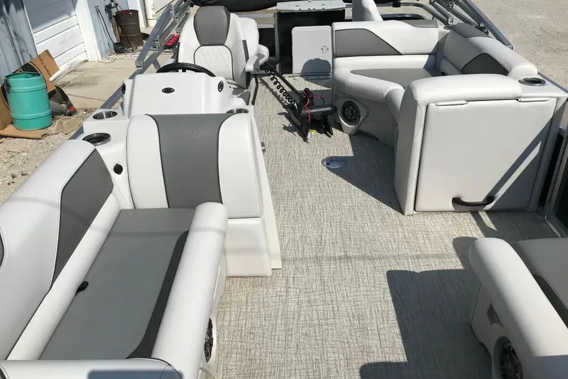 Slide: The Image of 2024 Avalon VENTURE FISH-N-CRUISE boat interior with gray and white seating. - 12