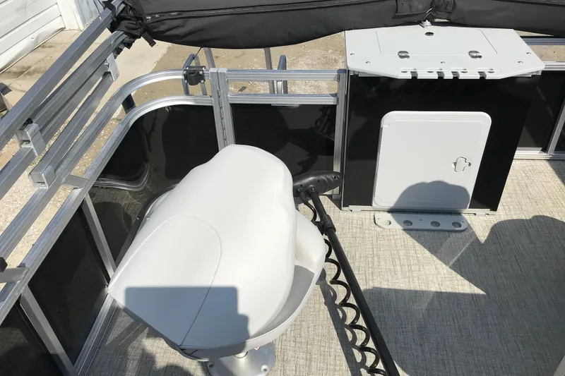 Slide: The Image of 2024 Avalon VENTURE FISH-N-CRUISE boat interior with seating and storage compartment. - 20