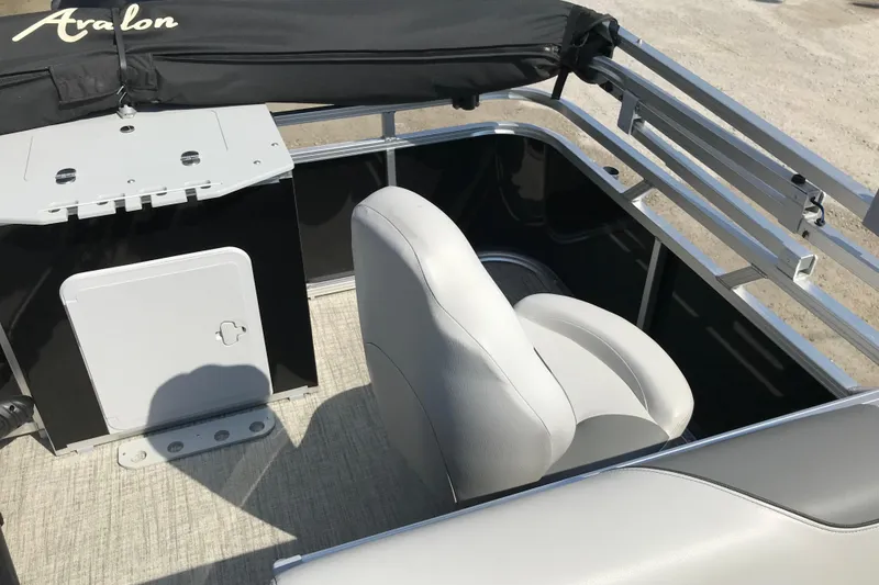 Slide: The Image of 2024 Avalon VENTURE FISH-N-CRUISE boat interior with seating and storage. - 21