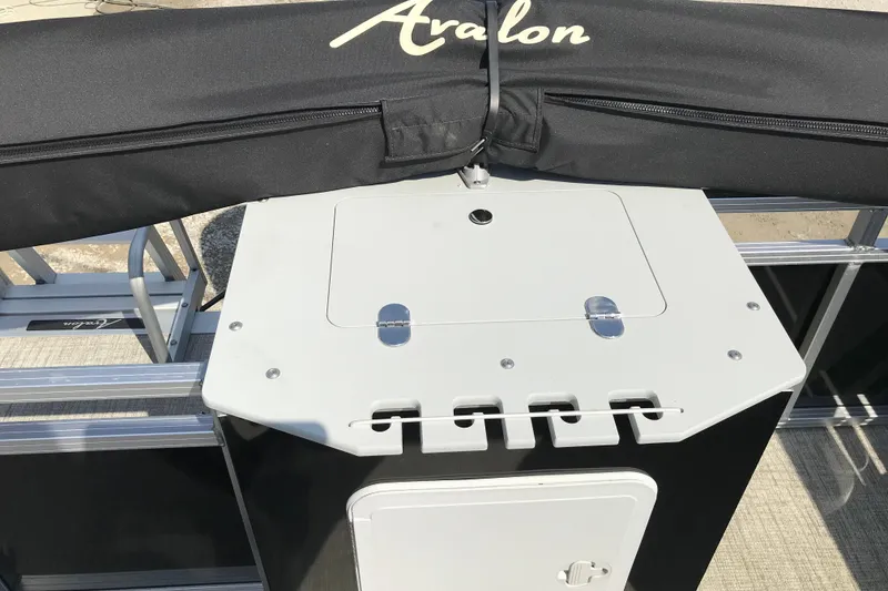 Slide: The Image of 2024 Avalon VENTURE FISH-N-CRUISE boat deck with storage compartment and cover. - 23