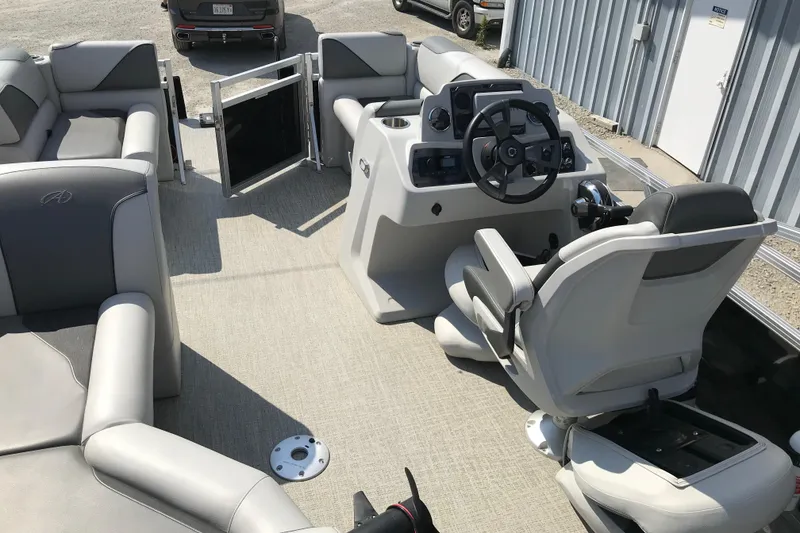 Slide: The Image of 2024 Avalon VENTURE FISH-N-CRUISE boat interior with steering console and seating. - 26