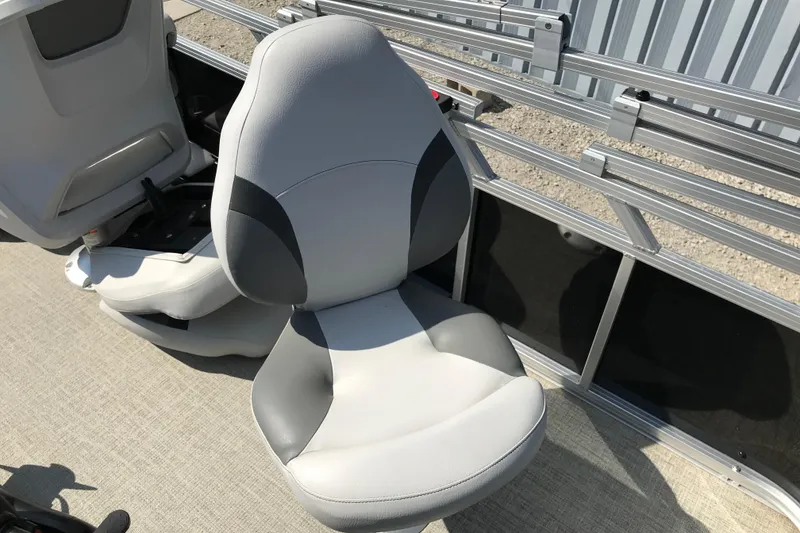 Slide: The Image of 2024 Avalon VENTURE FISH-N-CRUISE boat seat, gray and black design, outdoor setting. - 27