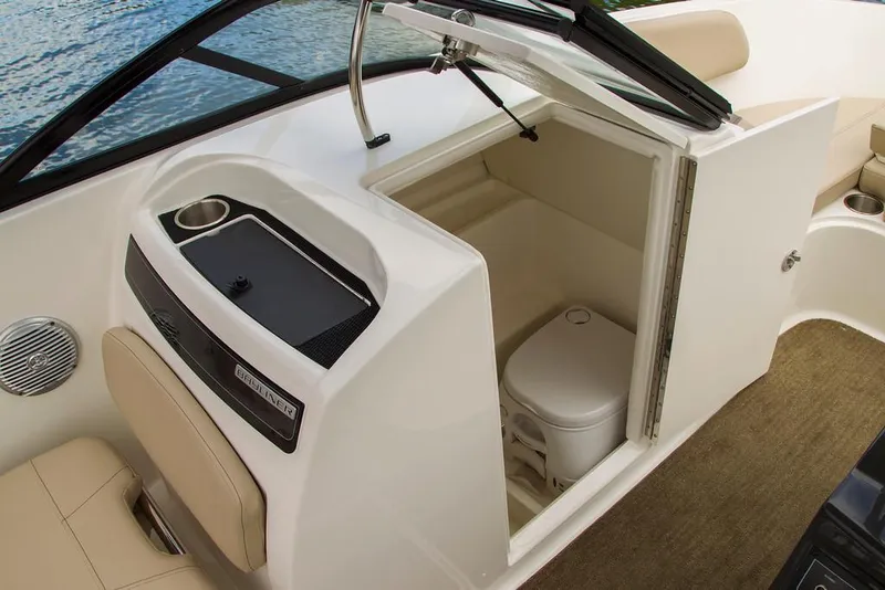 The Image of 2022 Bayliner VR6 Bowrider OB docked, featuring spacious seating and sleek design. - 0