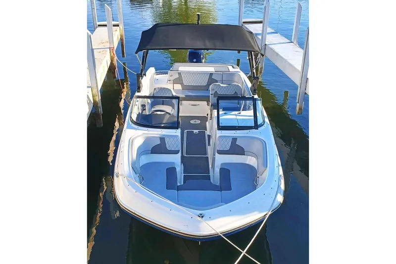 Slide: The Image of 2022 Bayliner VR6 Bowrider OB with Mercury engine, docked, featuring "Best Mistake" name. - 1