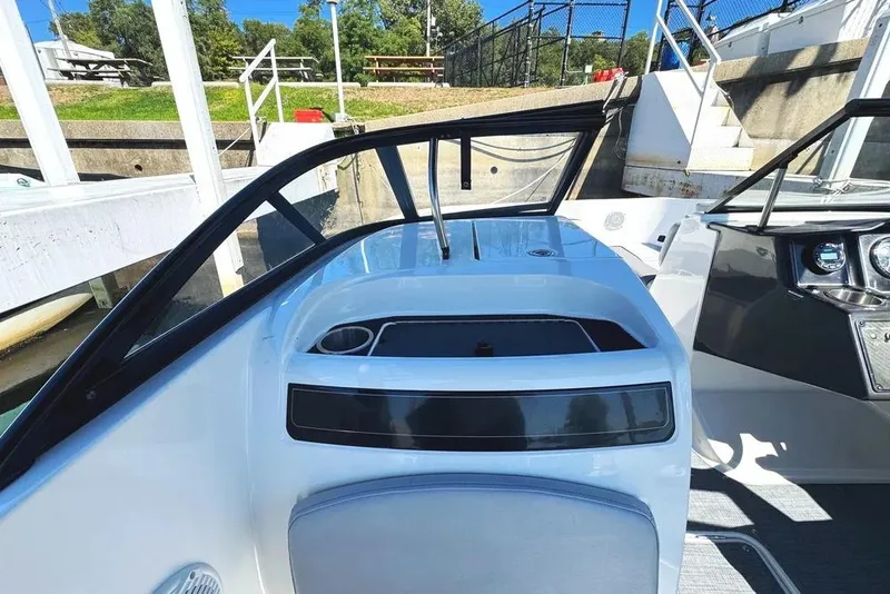 Slide: The Image of 2022 Bayliner VR6 Bowrider OB interior with cushioned seating and modern design. - 10