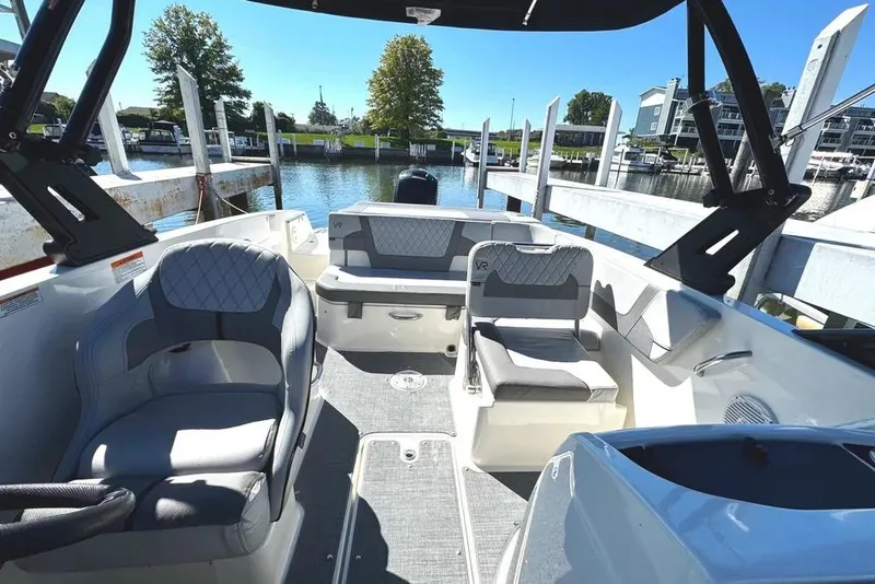 Slide: The Image of 2022 Bayliner VR6 Bowrider OB interior with sleek design and spacious seating. - 12