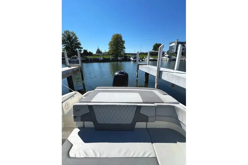 Slide: The Image of 2022 Bayliner VR6 Bowrider OB interior with storage compartments and cup holders. - 23