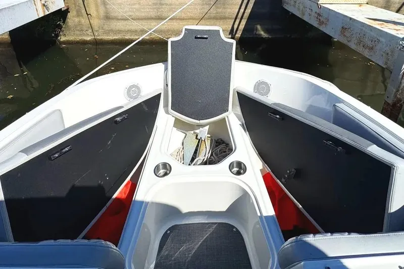 Slide: The Image of 2022 Bayliner VR6 Bowrider OB deck with metal fixture and textured flooring. - 24