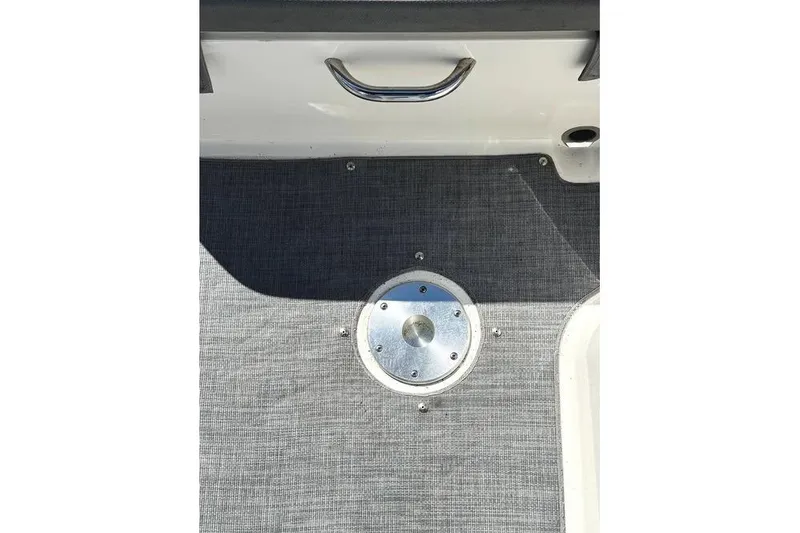 Slide: The Image of 2022 Bayliner VR6 Bowrider OB storage compartment with paddle and equipment. - 25