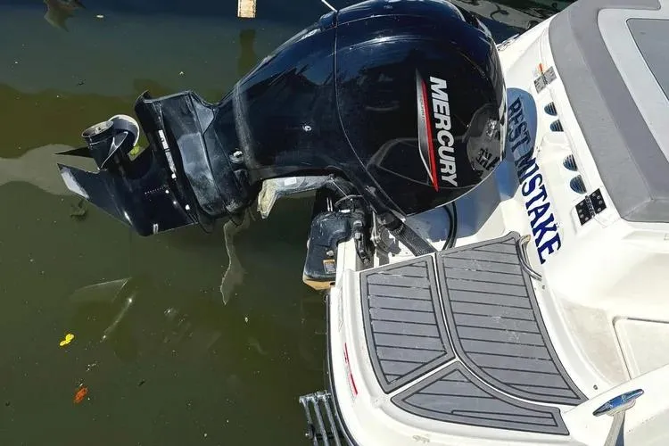 Slide: The Image of 2022 Bayliner VR6 Bowrider OB cockpit with plush seating and steering wheel. - 3