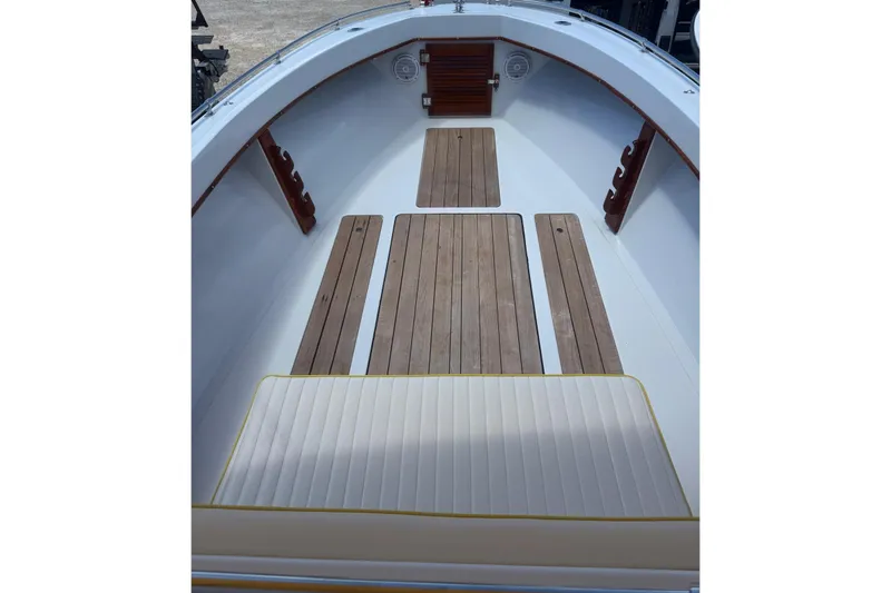 Slide: The Image of 1978 Formula boat interior with wooden flooring and cushioned seating. - 10