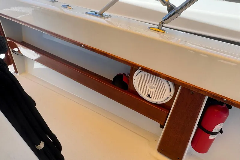 Slide: The Image of 1978 Formula boat interior with speaker, fire extinguisher, and wooden trim details. - 11
