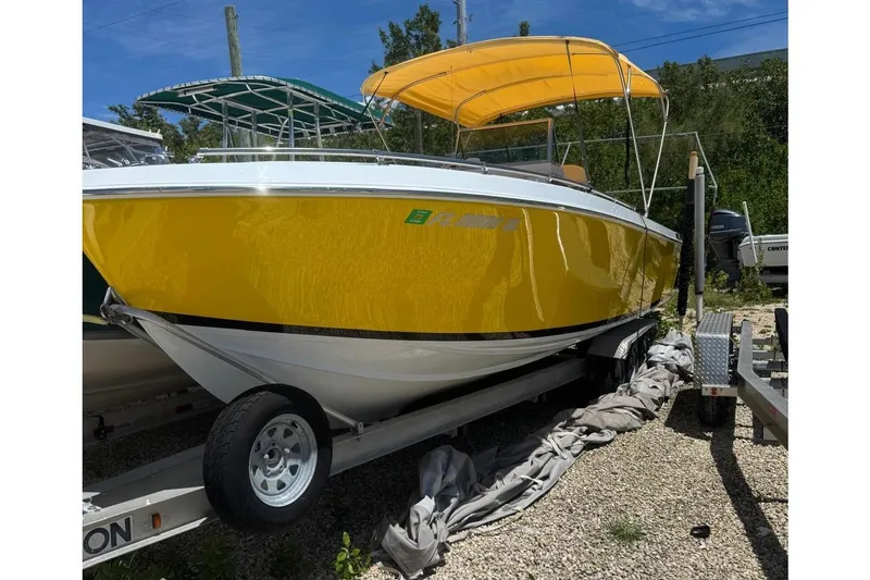 Slide: The Image of Yellow 1978 Formula boat with bimini top. - 2