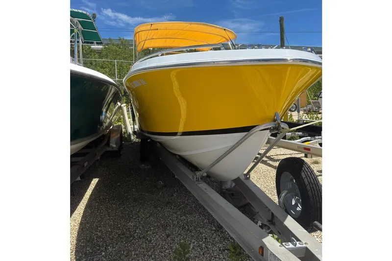 Slide: The Image of Yellow 1978 Formula boat on trailer under clear blue sky. - 3