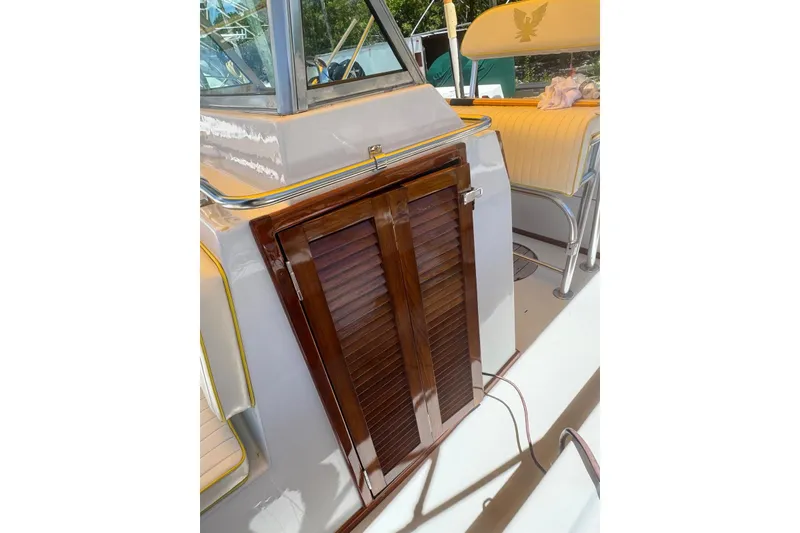 Slide: The Image of 1978 Formula boat interior with wooden cabinet and cushioned seating. - 9