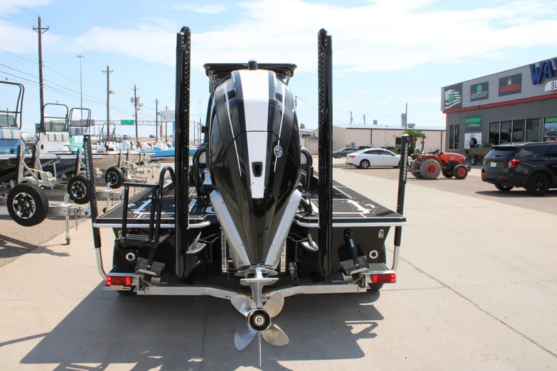 Slide: The Image of Rear view of a 2026 Mamba 227VX boat with powerful outboard motor. - 12