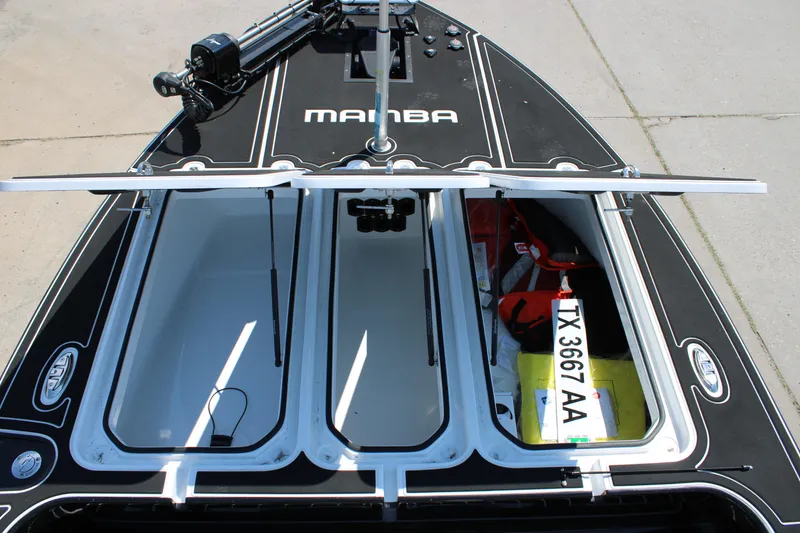 Slide: The Image of Mamba 227VX 2026 boat with open storage compartments and visible registration number. - 15