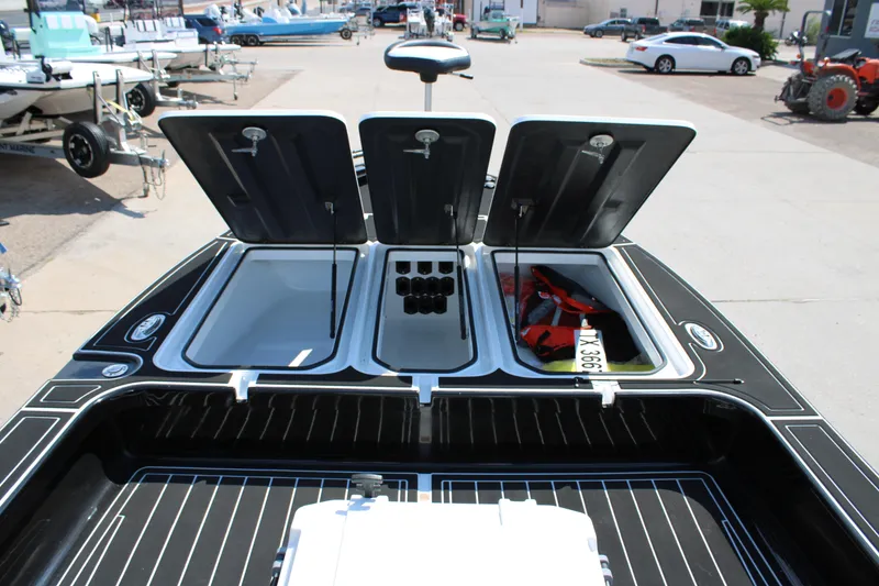 Slide: The Image of Open storage compartments on a 2026 Mamba 227VX boat, showcasing interior space and equipment. - 16