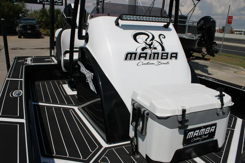 Slide: The Image of 2026 Mamba 227VX boat with custom design and cooler on deck. - 2