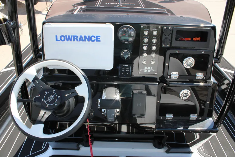 Slide: The Image of Control panel of 2026 Mamba 227VX boat with Lowrance system and steering wheel. - 20