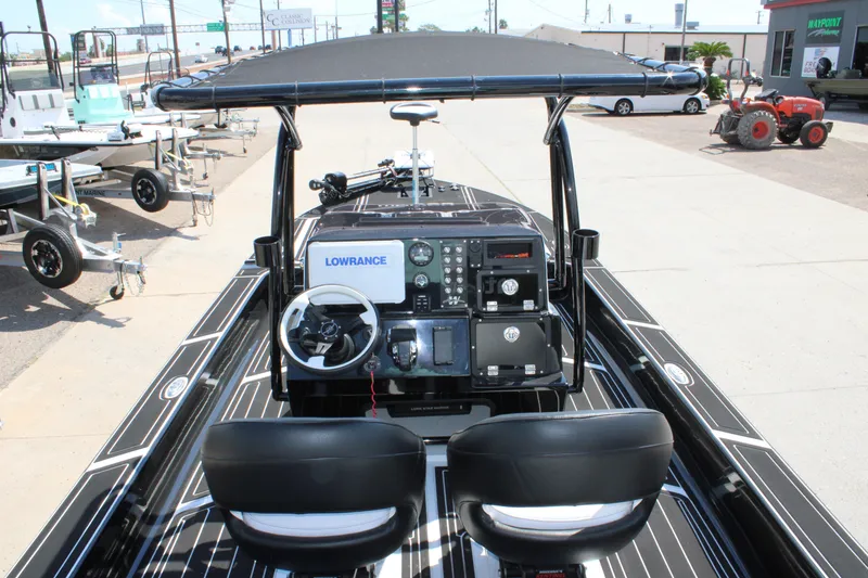 Slide: The Image of Mamba 227VX 2026 boat interior with steering console and navigation equipment. - 21