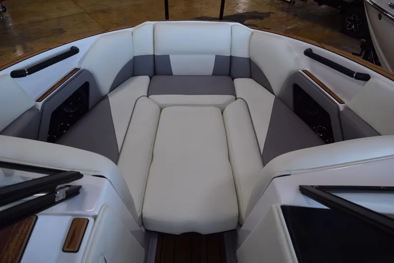 Slide: The Image of 2025 Moomba Craz boat interior with cushioned seating and sleek design. - 15