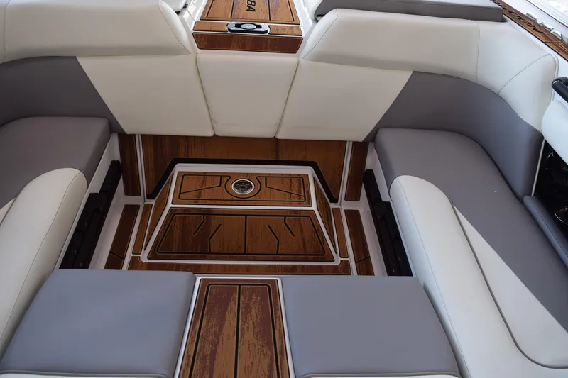 Slide: The Image of 2025 Moomba Craz boat interior with luxurious seating and wood accents. - 19
