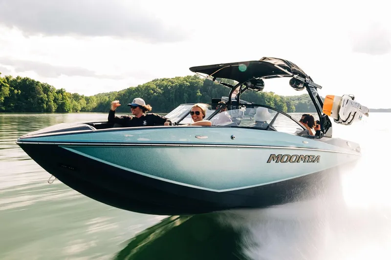 Slide: The Image of Manufacturer Provided Image: 2025 Moomba Craz boat cruising on a lake with passengers enjoying the ride. - 23