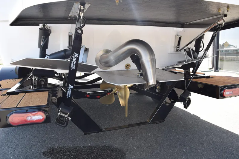 Slide: The Image of 2025 Moomba Craz boat underside showing propeller and exhaust system. - 8