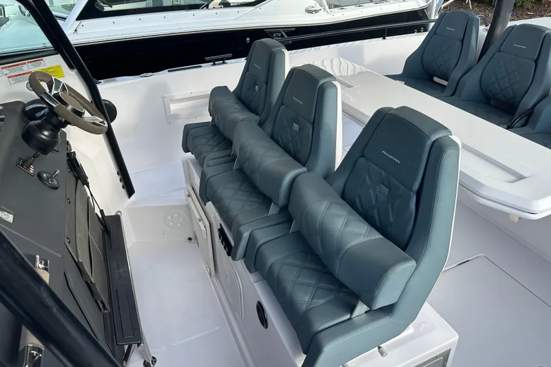 Slide: The Image of 2022 Axopar 37 Sun Top boat interior on a calm river. - 15