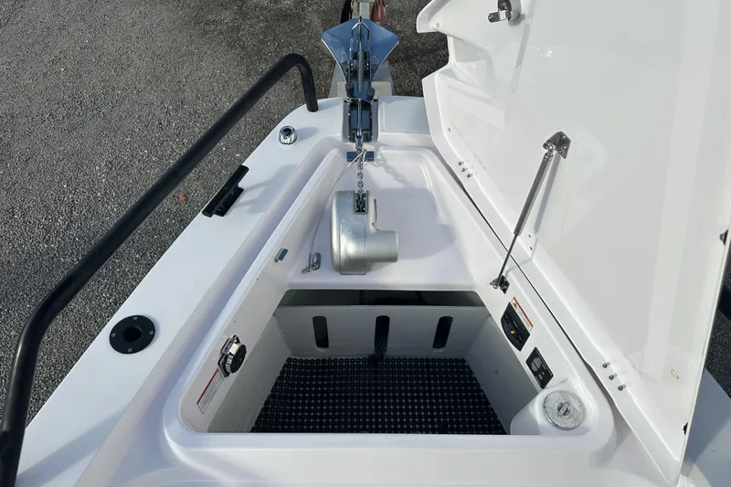 Slide: The Image of 2022 Axopar 37 Sun Top boat interior with steering wheel and navigation system. - 19
