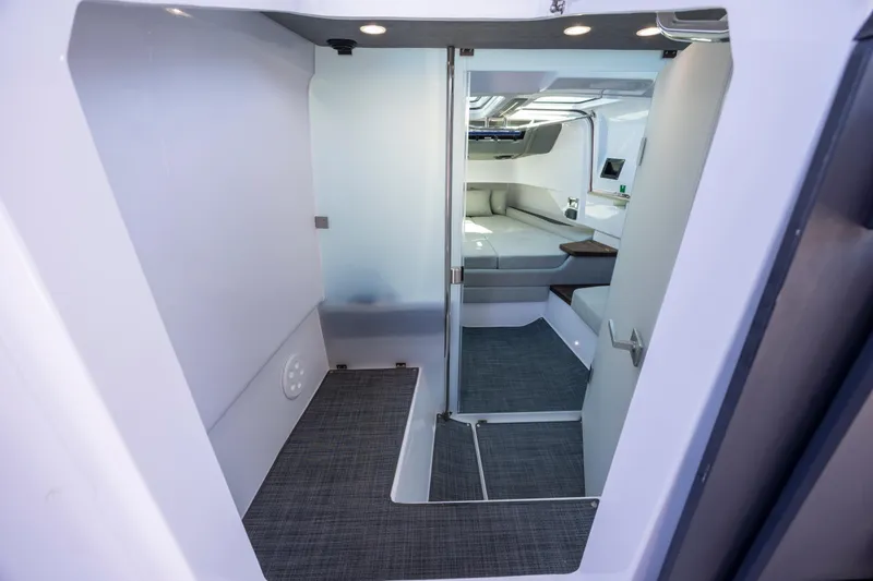 Slide: The Image of Interior cabin of 2022 Axopar 37 Sun Top, featuring modern design and comfortable seating. - 27