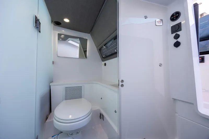 Slide: The Image of 2022 Axopar 37 Sun Top interior bathroom with modern fixtures and sleek design. - 28