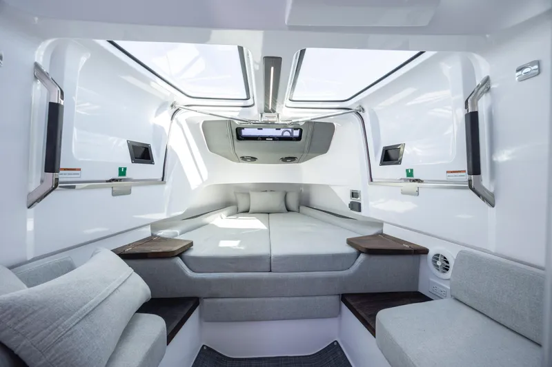 Slide: The Image of Luxurious interior of 2022 Axopar 37 Sun Top boat with modern seating and skylights. - 30