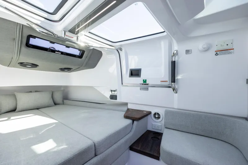 Slide: The Image of Interior of 2022 Axopar 37 Sun Top, featuring modern seating and skylight. - 32