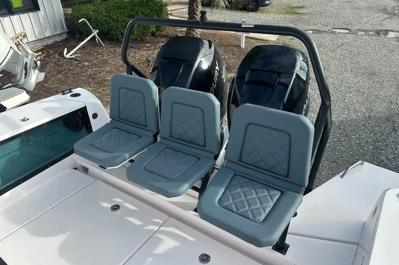 Slide: The Image of 2022 Axopar 37 Sun Top boat cruising on a calm river with scenic background. - 7