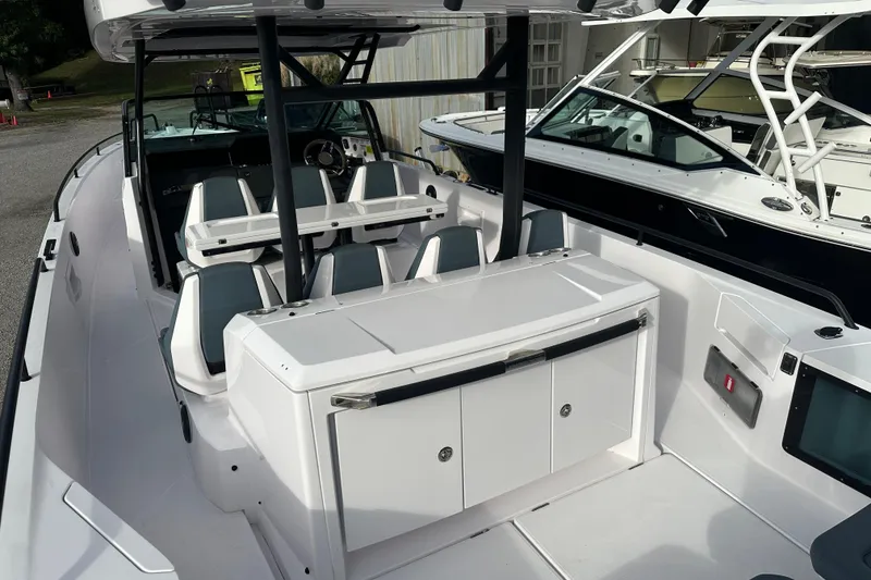 Slide: The Image of 2022 Axopar 37 Sun Top boat on a sunny day, featuring sleek seating and water view. - 8