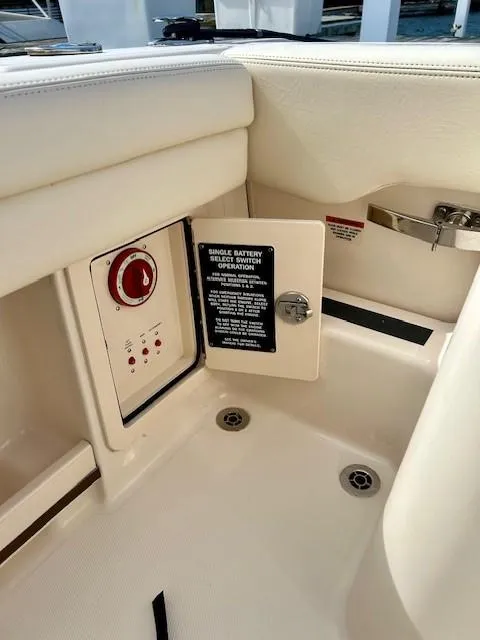 Slide: The Image of 2021 Grady-White Freedom 235 boat interior with battery switch panel. - 14