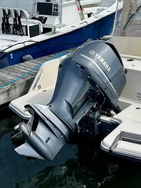 Slide: The Image of 2021 Grady-White Freedom 235 with Yamaha outboard motor docked at marina. - 17