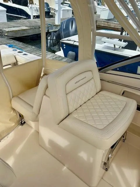 Slide: The Image of 2021 Grady-White Freedom 235 boat interior with luxurious seating and elegant design. - 8